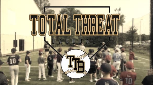Total Threat Baseball logo over players gathered during outdoor training